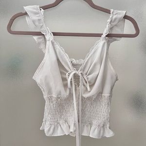 Flowy tie front tank top with lace details